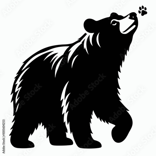 A stylized black silhouette of a bear walking, showcasing its furry texture and raised paw, symbolizing strength and nature.
