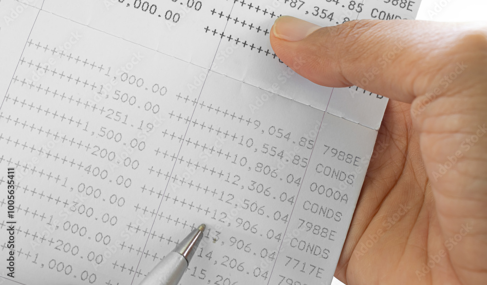 Obraz premium Bank account book statement balance number cash, hand holding data investment debt math in office, bill receipt and payment business credit card account, check paper financial loan tax concept.
