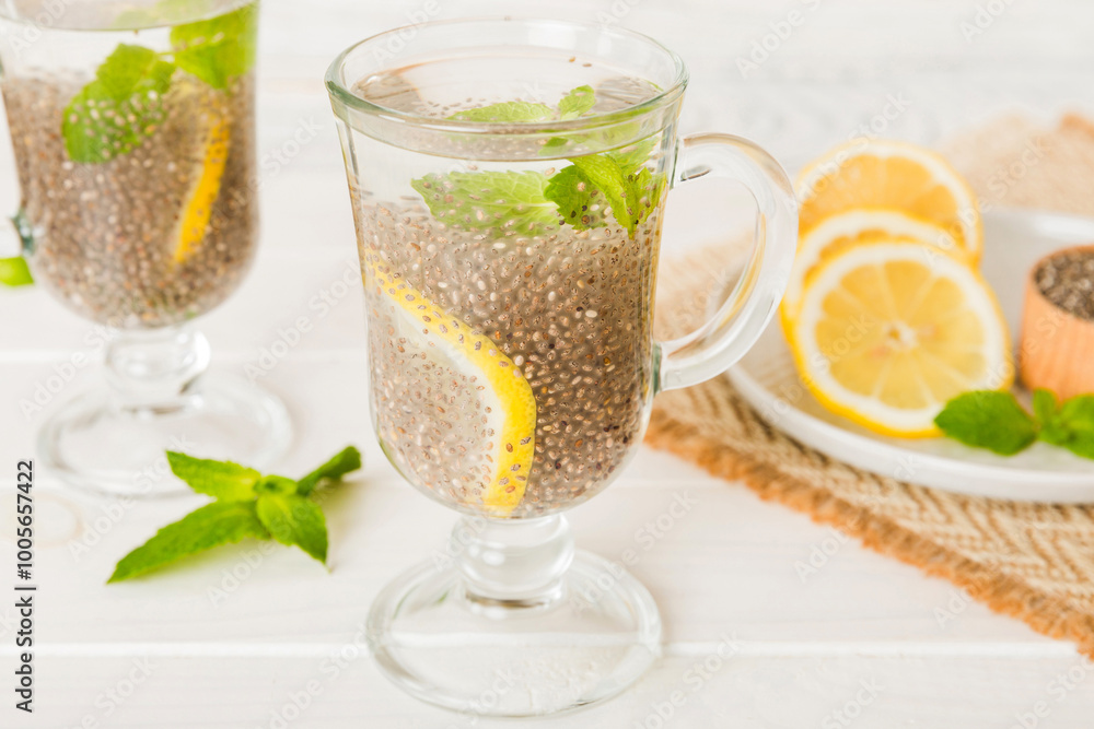 Healthy breakfast or morning with chia seeds lemon and mint on table background, vegetarian food, diet and health concept. Chia pudding with lemon and mint Healthy breakfast or morning with chia seeds lemon and mint on table background, vegetarian food, diet and health concept. Chia pudding with lemon and mint
