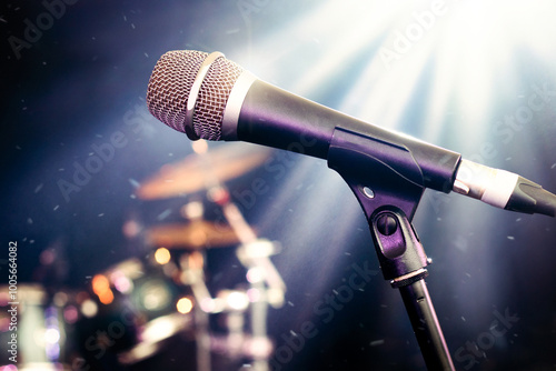 Photography Microphone on stage – live showbiz music setting featuring close up of vocal mic for singing