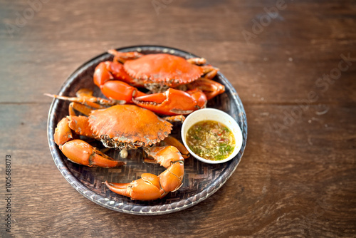 Steamed Crabs Served with Thai Seafood Dipping Sauce on a Wooden Tray - Traditional Thai Seafood Dish