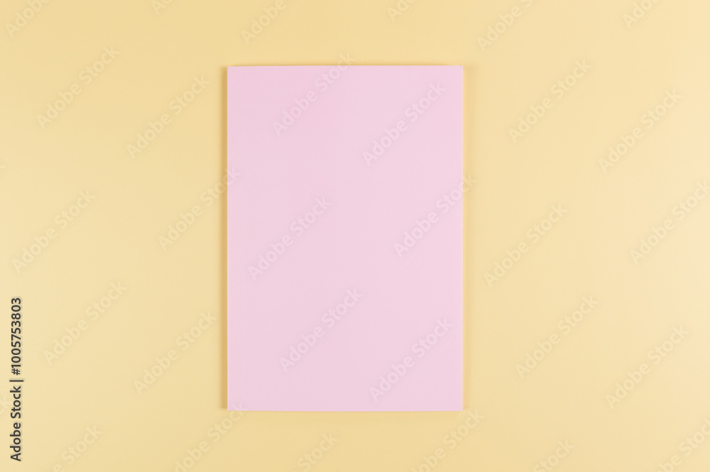 Top view of pink notebook on yellow background. School, office wallpaper. Flat lay, copy space. Top view of pink notebook on yellow background. School, office wallpaper. Flat lay, copy space.