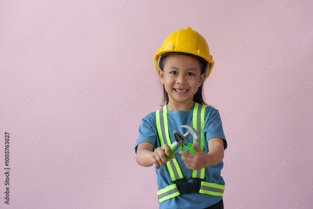 Little handyman with tools Cute child is a construction worker playing with a screwdriver, hammer, drill, construction equipment, and engineering, the dream job of a young Asian girl in the future. Little handyman with tools Cute child is a construction worker playing with a screwdriver, hammer, drill, construction equipment, and engineering, the dream job of a young Asian girl in the future.