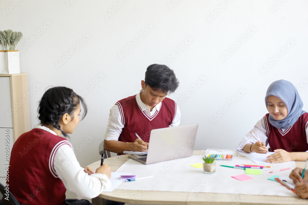 High School Students Doing School Work Together at The Study Room