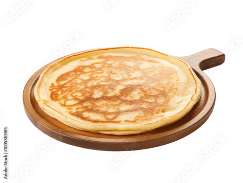 a pancake on a wooden plate photo