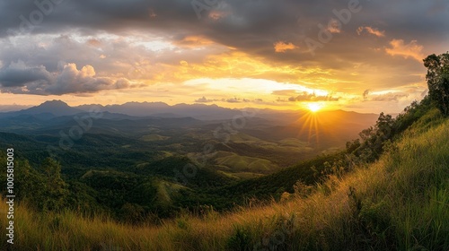 A sunset view over the mountains in Khao Yai National Park, with golden light illuminating the landscape.