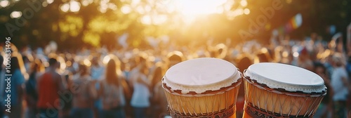 Close-up of two djembe drums on the background of the crowd.