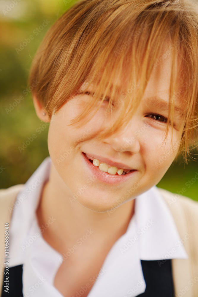 close-up. Portrait of lilt blonde teenage girl with short haircut in school uniform. adolescent crisis. Center for Psychological Support for Children. close-up. Portrait of lilt blonde teenage girl with short haircut in school uniform. adolescent crisis. Center for Psychological Support for Children.