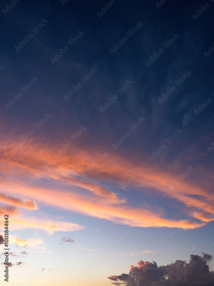 blue sky with clouds and sun, the sunset behind the clouds blue sky with clouds and sun, the sunset behind the clouds