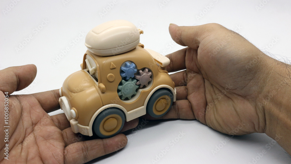 Fototapeta premium A brown children's toy car that looks very cute