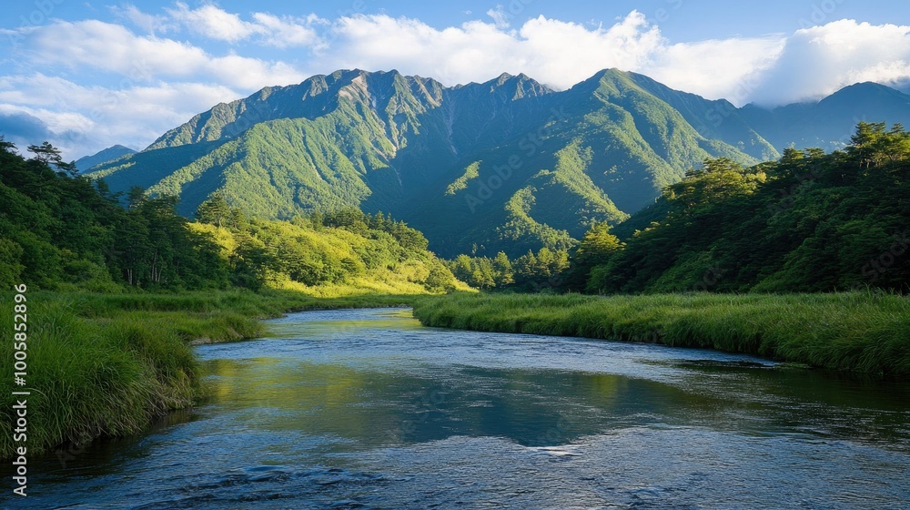 The peaceful Azusa River winds through the lush green valley of Kamikachi, with the majestic Hotaka Mountains standing tall in the background. The peaceful Azusa River winds through the lush green valley of Kamikachi, with the majestic Hotaka Mountains standing tall in the background.