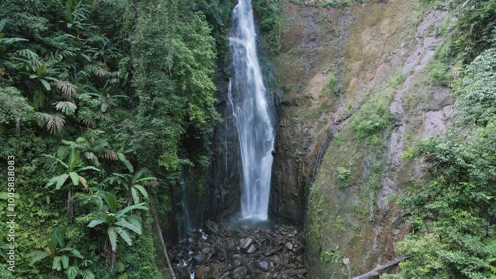 close-up drone video of a waterfall in the mountains, the drone moves up then down and the camera faces straight at the waterfall
close-up drone video of a waterfall in the mountains, the drone moves up then down and the camera faces straight at the waterfall