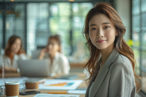 Business lady at the office working with laptop and smiling Free Download Business lady at the office working with laptop and smiling - GFXLoad