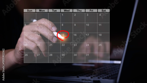 Businessman points pen at virtual table Appointment schedule On the calendar to make a meeting, project management concept Analysts work with computers in management systems to make reports.