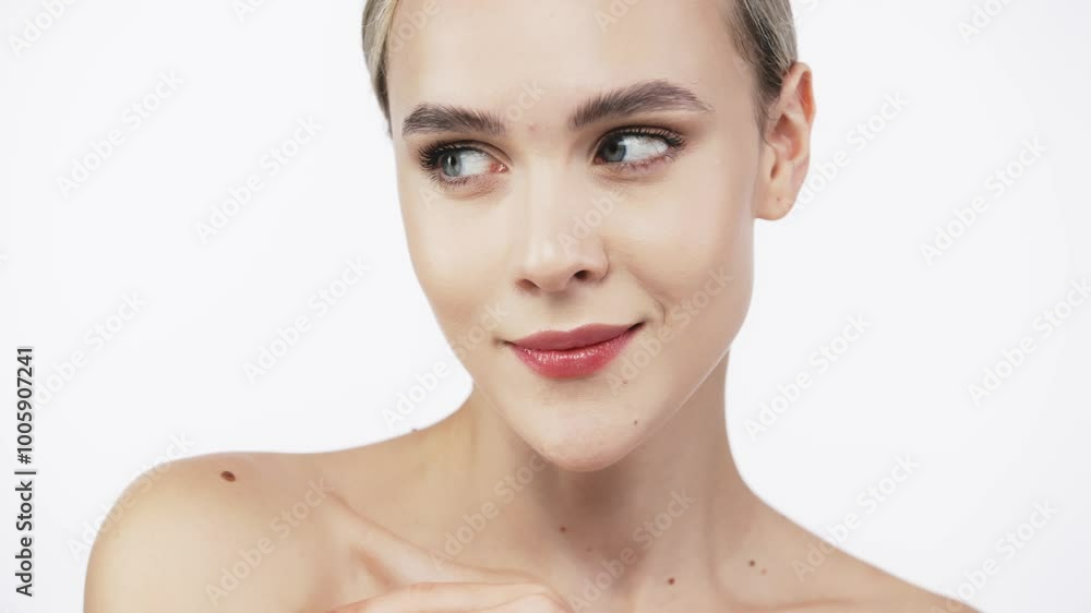 A portrait of a young, beautiful woman with perfectly smooth skin against a white background. This image embodies tenderness and sensuality, highlighting the essence of natural beauty and skincare. A portrait of a young, beautiful woman with perfectly smooth skin against a white background. This image embodies tenderness and sensuality, highlighting the essence of natural beauty and skincare.