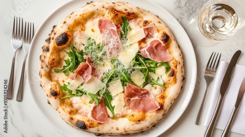 Delicious pizza topped with prosciutto, arugula, and cheese on a white plate, perfect for food lovers and gourmet dining.