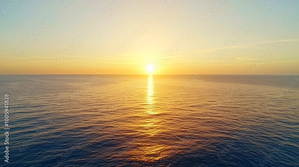 Fototapeta premium A golden sunset over a vast ocean, casting a warm glow, golden sunset, natural beauty