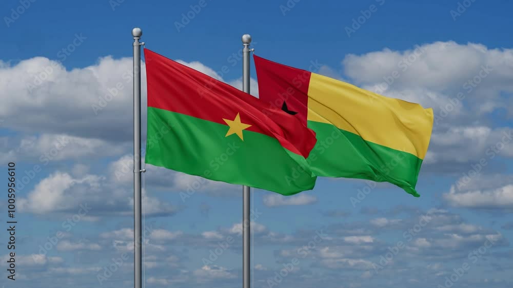 Guinea-Bissau and Burkina Faso flags flying together, video concept of the relationship, two country relations concept Guinea-Bissau and Burkina Faso flags flying together, video concept of the relationship, two country relations concept