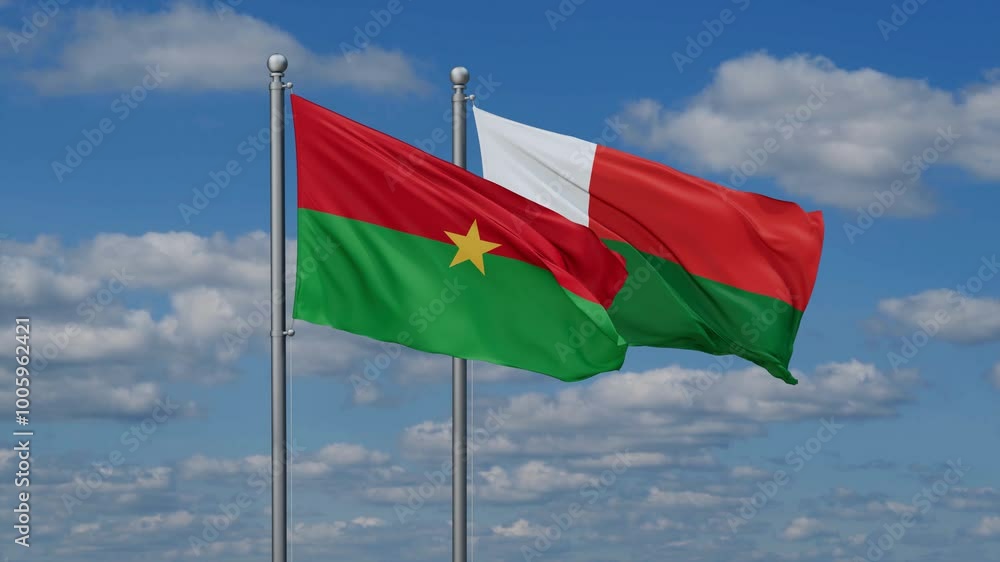 Madagascar and Burkina Faso flags flying together, video concept of the relationship, two country relations concept Madagascar and Burkina Faso flags flying together, video concept of the relationship, two country relations concept