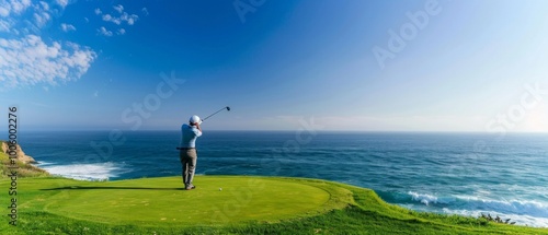 A man dressed in golf attire swings on a lush green course overlooking the Pacific Ocean. The serene setting enhances his focus and the beauty of the scene.