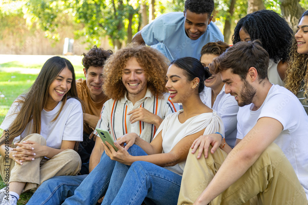 Group of friends smiling and watching something funny on mobile phone outdoors Group of friends smiling and watching something funny on mobile phone outdoors