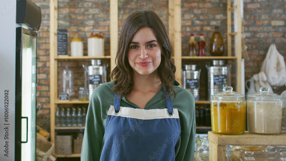 Portrait Of Female Sales Assistant Or Owner Working In Sustainable Plastic Free Grocery Store Portrait Of Female Sales Assistant Or Owner Working In Sustainable Plastic Free Grocery Store