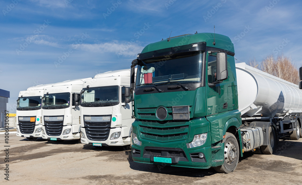 custom made wallpaper toronto digitalSeveral trucks are parked in the parking lot on a sunny day. view of the cabins. Commercial vehicles, advertising of vehicles for cargo transportation. Forwarders are waiting for professional drivers