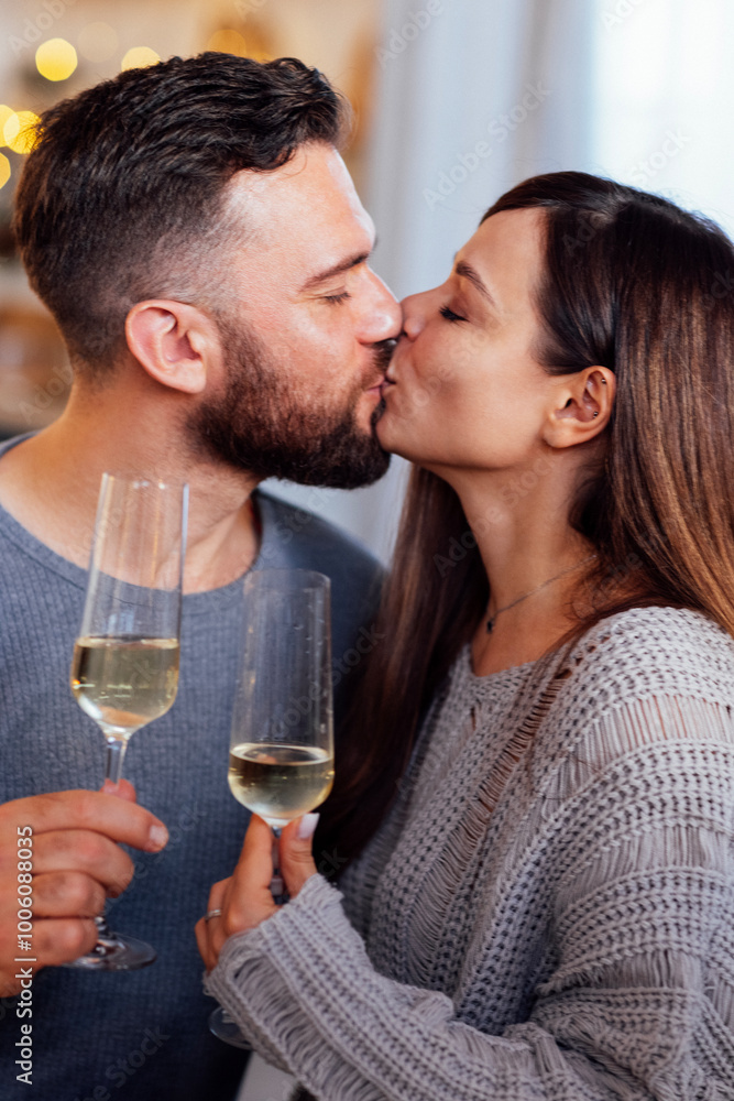 A happy couple in love is sitting at a festive table at home A happy couple in love is sitting at a festive table at home