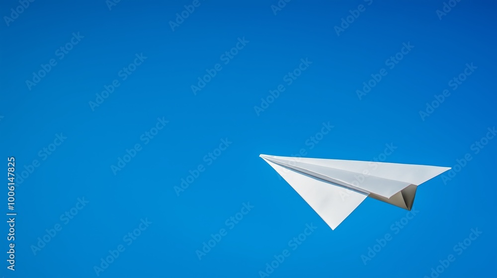 Isolated paper airplane on a clear blue sky background. Isolated paper airplane on a clear blue sky background.