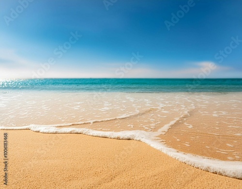 Sunny Beach With Golden Sand and Calm Waves Under Bright Blue Sky Midday