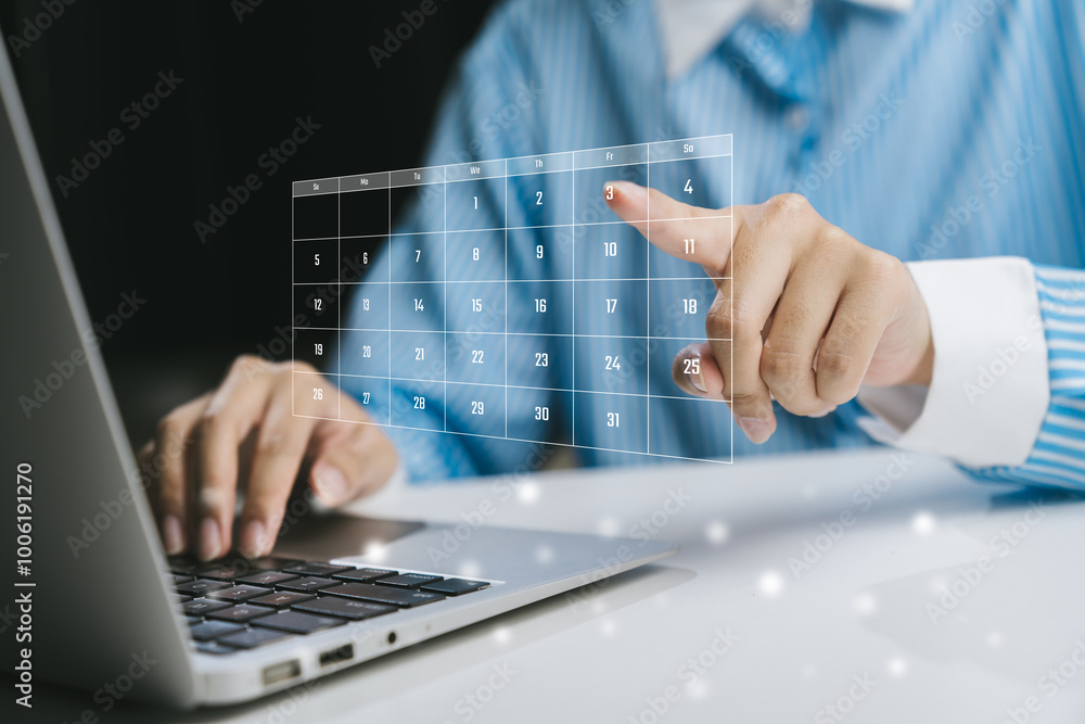 Business professional interacting with a holographic interface above a laptop, symbolizing modern technology and innovation. Business professional interacting with a holographic interface above a laptop, symbolizing modern technology and innovation.