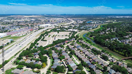 Fast growing mixed-use development area along Sam Rayburn Tollway, East Highway 121 in Lewisville – Coppell Texas, commercial buildings, warehouse, residential houses, downtown Dallas background