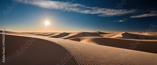 Vast desert landscape with undulating sand dunes under a bright sun  Evokes serenity and warmth, ideal for travel or nature themes photo