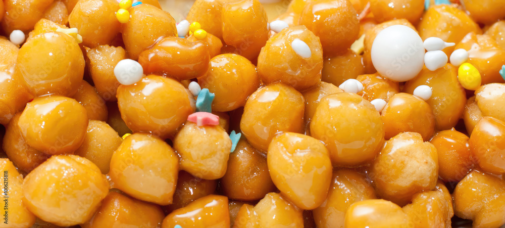 Delicious struffoli, italian honey balls, forming a background image Delicious struffoli, italian honey balls, forming a background image