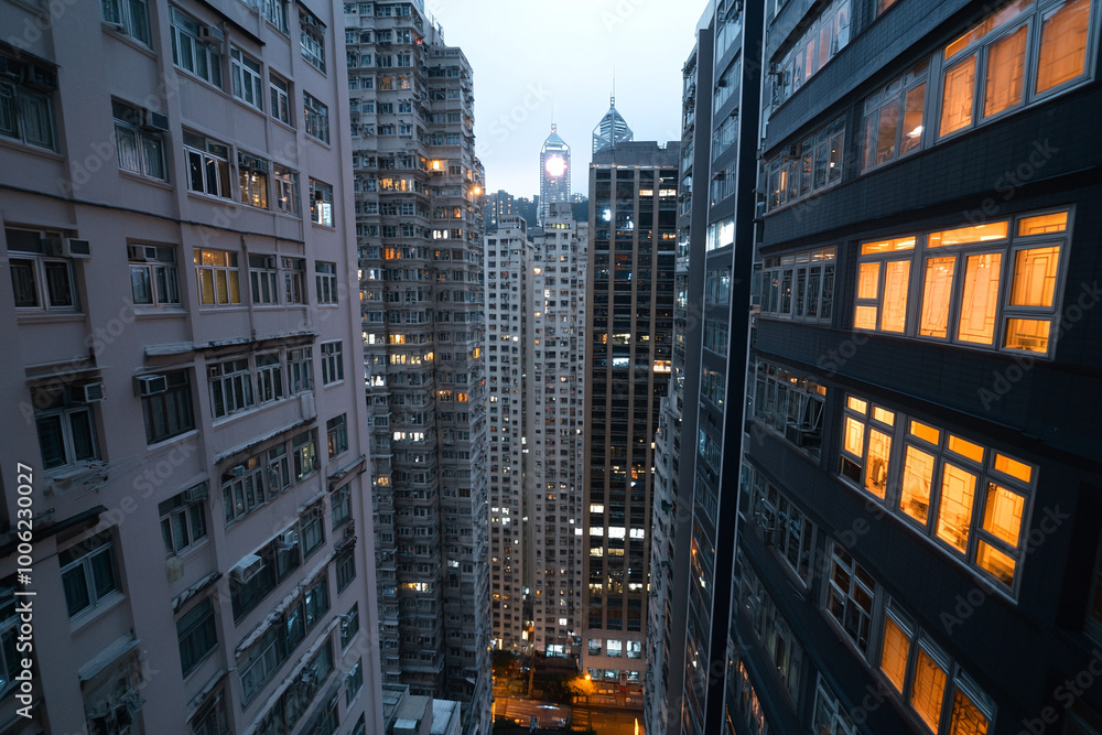 Evening glass skyscrapers in the city. View between buildings Evening glass skyscrapers in the city. View between buildings