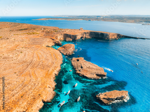 Aerial view of the Blue Lagoon and Cominotto Island on Comino, Malta, with crystal-clear Mediterranean waters
