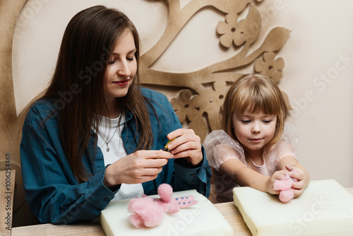 A mother and daughter crafting together on a cozy afternoon