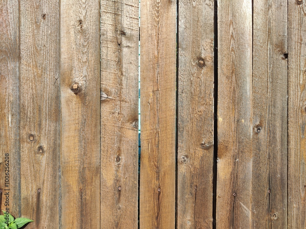 Fototapeta premium Rustic wooden fence with natural texture and space for text, ideal for announcements or decorative displays