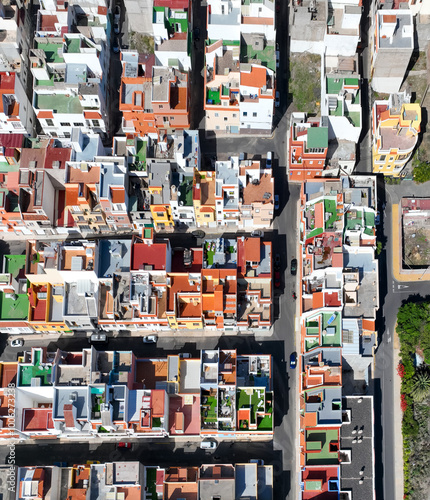 Colored roofs and houses in the village on Tenerife island, top view from a drone. photo