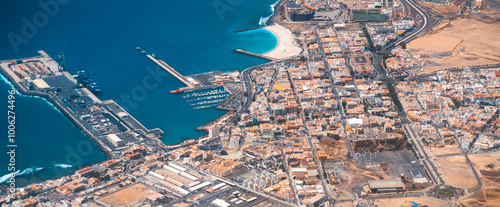 Aerial view, the city with a deserty terrain and the ocean, Fuerteventura island. photo