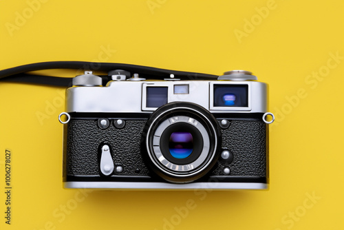 A camera in and yellow with a blue . Studio happy man concept. Stylish and yellow camera on a white. Stylish and yellow framed camera on lifestyle a white.