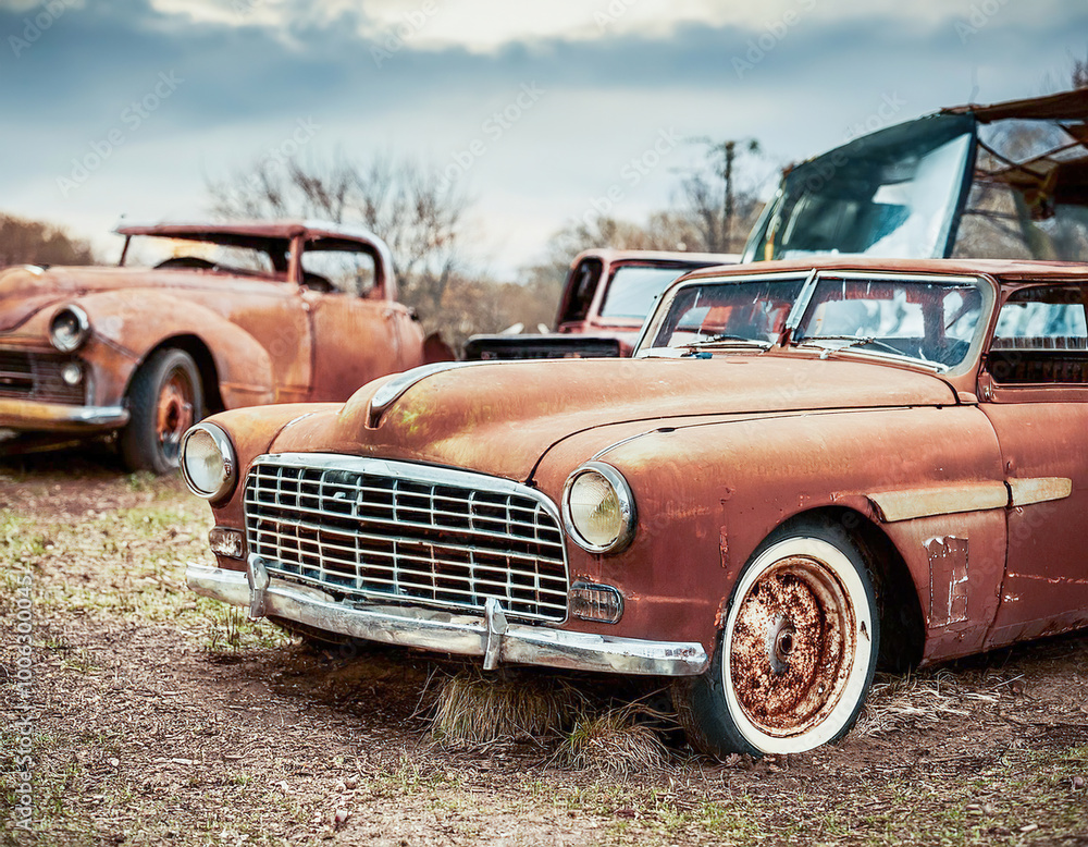 Classic American vehicles rusting away in a Retro Dystopia background Classic American vehicles rusting away in a Retro Dystopia background