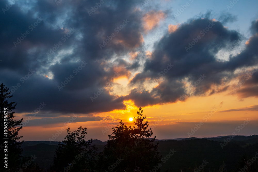 Sunset and cloudscape over Col de la Faucille, French Jura Sunset and cloudscape over Col de la Faucille, French Jura