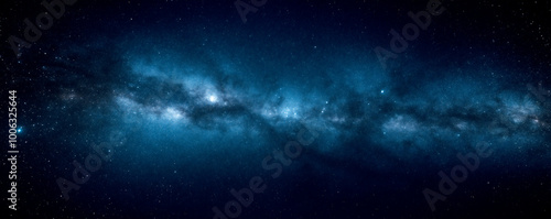 A dark blue background with stars, galaxies, and space dust. Viewing the universe in an abstract manner.