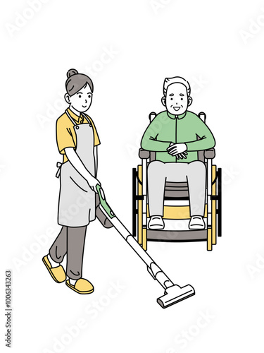 高齢者の住む部屋の掃除をする介護士