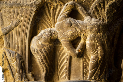 dancer with loose hair, Romanesque capital in the cloister, San Pedro el Viejo Monastery, Huesca, Aragon community, Spain photo