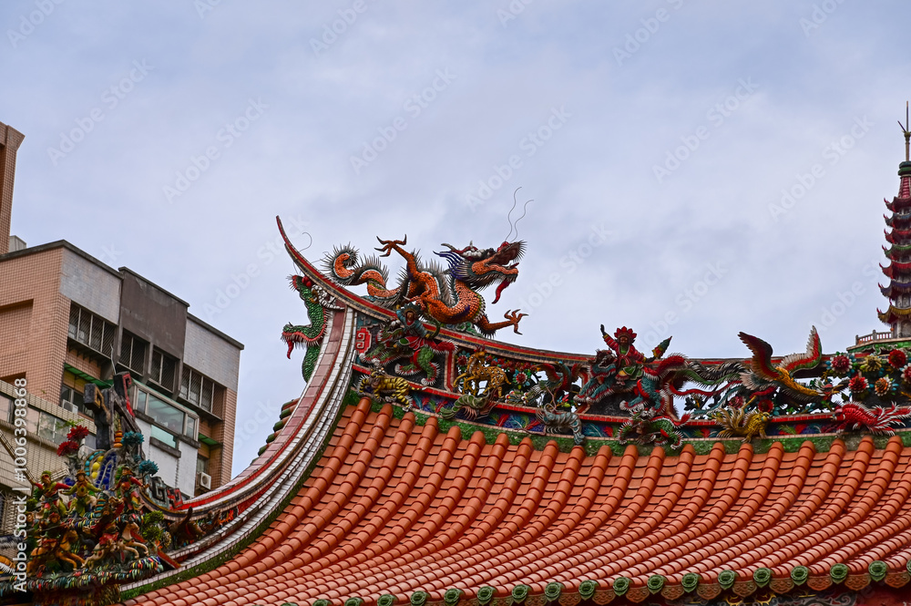 Fototapeta premium Close-up of the ornate decor on the Mengjia Longshan Temple in Taipei, Taiwan. Chinese folk religion landmark. Buddhist Temple. Religious and traditional Chinese art. 