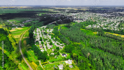 drone view aerial photography of country side rural village settlement spring vivid sunny day weather with railroad path transportation infrastructure object