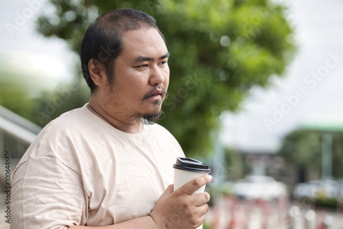 Slika na platnu Unhappy and angry middle aged man not feeling satisfying after tasting bad taste