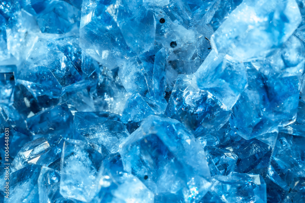 Blue Crystal Mineral Stone. Gems. Mineral crystals in the natural environment. Texture of precious and semiprecious stones. Seamless background with copy space colored shiny surface of precious stones Blue Crystal Mineral Stone. Gems. Mineral crystals in the natural environment. Texture of precious and semiprecious stones. Seamless background with copy space colored shiny surface of precious stones